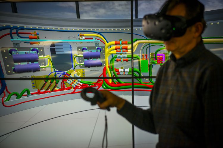 Jim Maul, senior staff engineer, propulsion systems, Northrop Grumman, demonstrates the use of tools in virtual reality. (Photo Credit: Northrop Grumman) Big Booster Benefits – First Flight of Longest Monolithic Solid Rocket Motors (2)