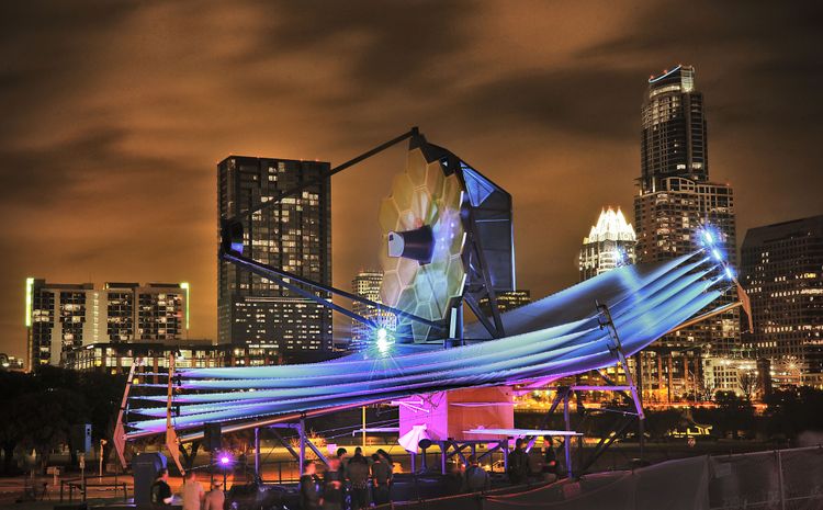 The Northrop Grumman full-scale model of NASA’s James Webb Space Telescope graces the skyline of Austin, Texas in 2013. The model is the length of a tennis court and approximately 3 stories tall. (Photo Credit: NASA/Chris Gunn) Northrop Grumman Gifts James Webb Space Telescope Full-Scale Model to the Space Foundation