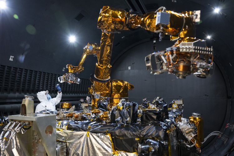 The robotics payload, including two robotic arms and electronics developed by the U.S. Naval Research Laboratory, and an engineer performing inspection. (Photo Credit: NRL) Northrop Grumman One Step Closer to Delivering Mission Robotic Vehicle for On-Orbit Satellite Servicing Missions